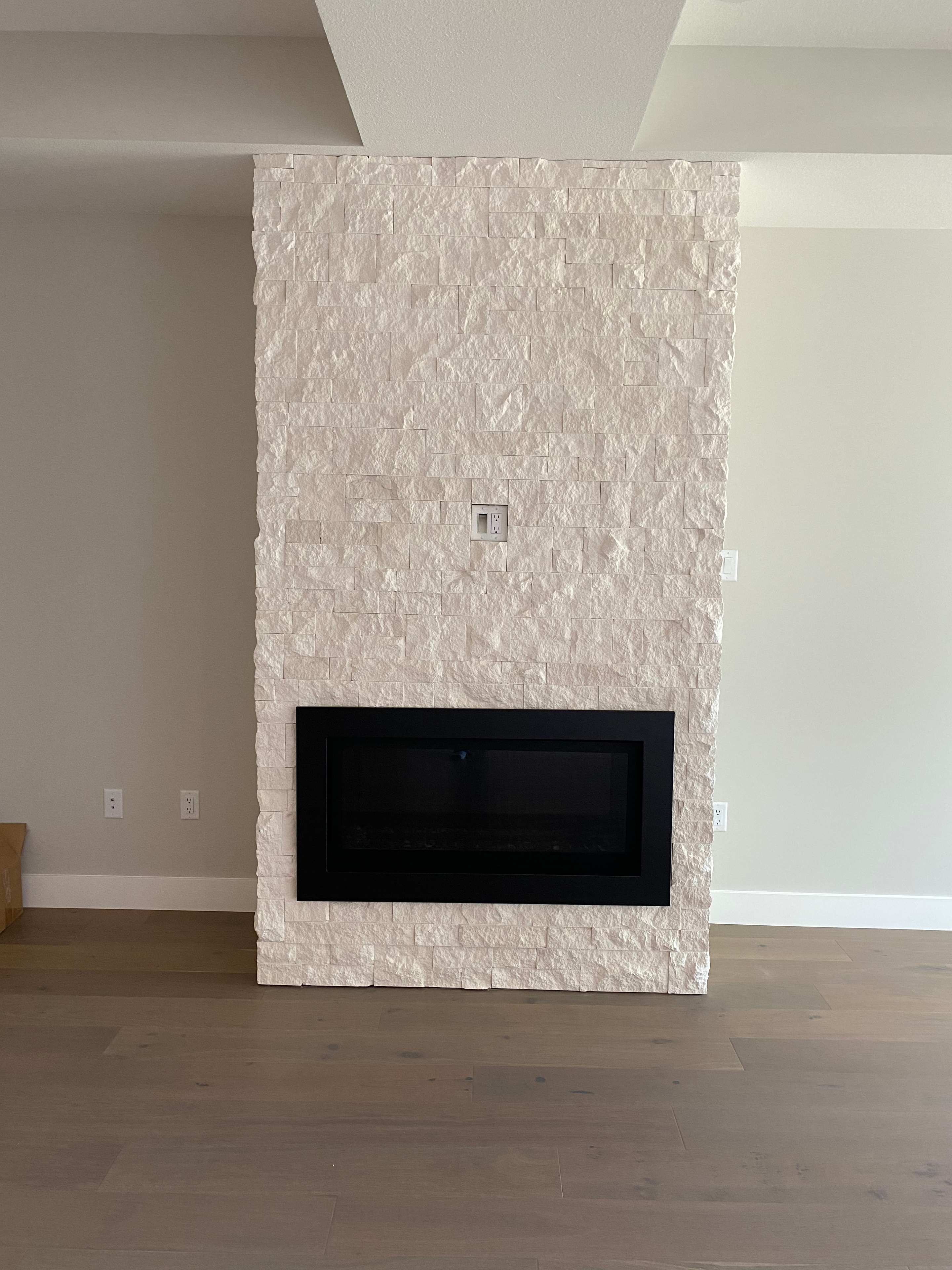 Trout Creek Residence — stone cladding feature wall with fireplace