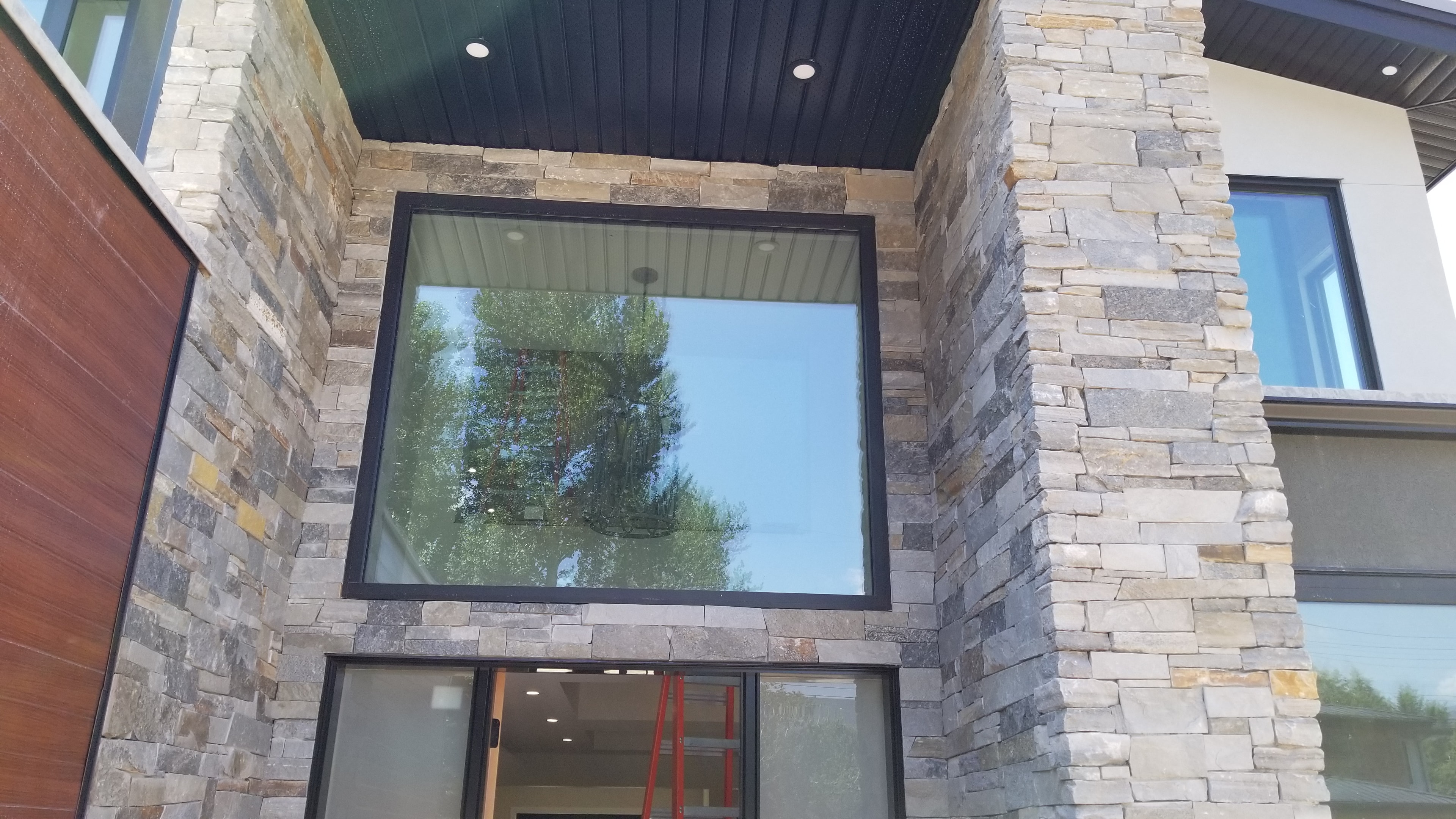 Trout Creek Residence — stone cladding entry detail with large glazing